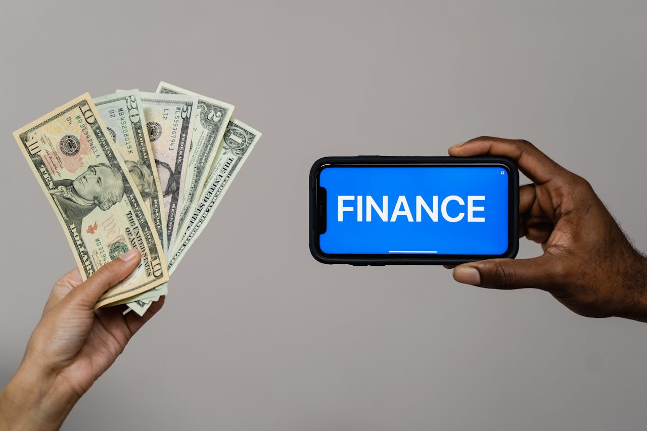 our-journey-03 Image depicting currency and finance concept with hands holding cash and a smartphone.